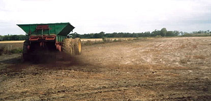 Manure spreading on cropping soil.